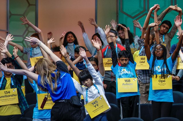 Spellers in the Scripps National Spelling Bee take a stretch break during the competition in National Harbor, Maryland on May 29, 2024. (Photo by Evelyn Hockstein/Reuters)
