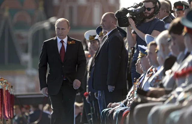 Russian President Vladimir Putin arrives for the Victory Day parade in Moscow's Red Square May 9, 2014. (Photo by Alexei Nikolskiy/Reuters/RIA Novosti/Kremlin)