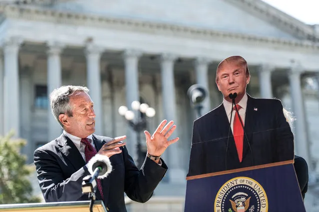 Former South Carolina Gov. Mark Sanford speaks to the media with a cardboard cutout of President Donald Trump during a campaign stop at the state house on September 16, 2019 in Columbia, South Carolina. Sanford is running against the Republican president in the primary election. (Photo by Sean Rayford/Getty Images)