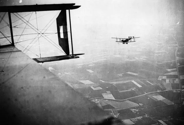 British Handley-Page bombers on a mission, Western Front, during World War I. This photograph, which appears to have been taken from the cabin of a Handley-Page bomber, is attributed to Tom Aitken. It shows another Handley-Page bomber setting out on a bombing mission. (Photo by Tom Aitken/National Library of Scotland via The Atlantic)