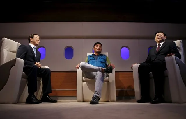 A man sits between the wax figures of U.N. Secretary-General Ban Ki-moon (L) and Chinese President Xi Jinping (R) at Grevin Wax Museum in central Seoul, South Korea, July 30, 2015. (Photo by Kim Hong-Ji/Reuters)