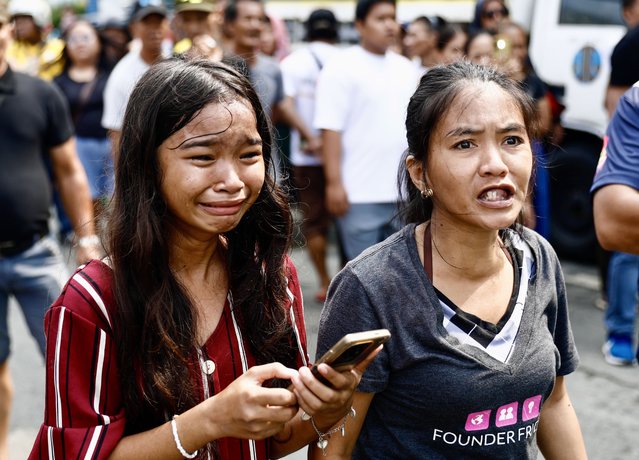 Filipino informal settlers react during a demolition raid at a shanty town in Pasay City, Metro Manila, Philippines, 01 August 2024. (Photo by Francis R. Malasig/EPA)