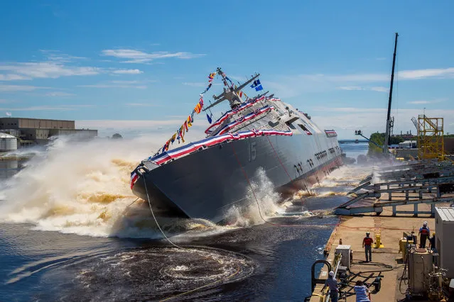 The U.S. Navy’s future USS Billings (LCS 15) launches sideways into the Menominee River in Marinette, Wisconsin, following its christening by ship sponsor Sharla Tester, on July 1, 2017. Once commissioned, LCS-15 will be the first ship of its name in naval service. (U.S. Navy photo courtesy of Lockheed Martin/Released)