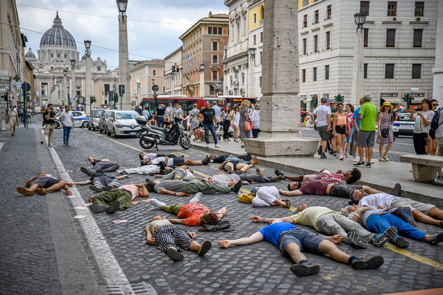 Climate activists from Ultima Generazione (Last Generation) lay down on the ground during a climate crisis protest at Via della Conciliazione, on June 29, 2023 in Rome, Italy. Two Italian climate activists from the Ultima Generazione (Last Generation) group were given a suspended prison sentence and ordered to pay nearly 30,000 in damages for glueing themselves to the base of Laocoon statue in the Vatican museum last year. Ultima Generazione – Last Generation is an Italian non-violent civil disobedience campaign born in 2021 within the Extinction Rebellion movement and now independent. Ultima Generazione demands the reopening of disused coal plants and cancel the project of new drilling for the research and extraction of natural gas, and to increase solar and wind energy by at least 20GW this year, to create thousands of new jobs in renewable energy. (Photo by Antonio Masiello/Getty Images)