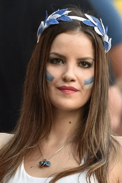 A Greek fan waits for the start of the Round of 16 football match between Costa Rica and Greece at Pernambuco Arena in Recife during the 2014 FIFA World Cup on June 29, 2014. (Photo by Aris Messinis/AFP Photo)