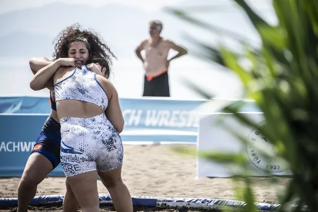 In this handout image provided by United World Wrestling, Aysegul Ozbege (facing camera) of Turkey competes against Stefania Zacheila of Greece during the final day of the first stop of the UWW Beach Wrestling World Series on May 29, 2022 in Sarigerme, Turkey. (Photo by Dean Treml/UWW via Getty Images)