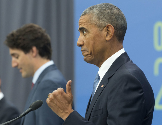 President Barack Obama give a “thumbs-up” as he reacts to comments made by Canadian Prime Minister Justin Trudeau, left, during a news conference for the North America Leaders' Summit at the National Gallery of Canada, Wednesday, June 29, 2016 in Ottawa, Canada. (Photo by Pablo Martinez Monsivais/AP Photo)