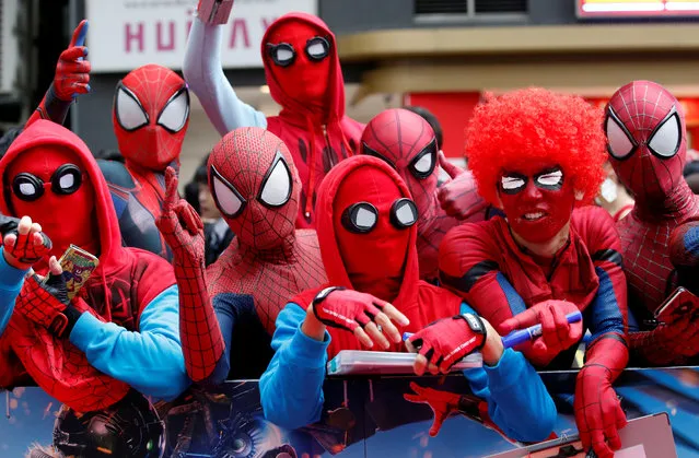 Fans in Spider-Man costumes wait for the arrival of cast member Tom Holland and director Jon Watts during the Japan premiere of “Spider-Man: Homecoming” in Tokyo, Japan August 7, 2017. (Photo by Kim Kyung-Hoon/Reuters)