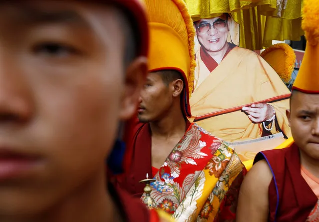 Tibetan monks carry a portrait of Dalai Lama during his birthday celebration in Kathmandu, Nepal, July 6, 2016. (Photo by Navesh Chitrakar/Reuters)
