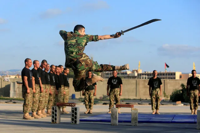 Palestinian Fatah members demonstrate their skills during a military display as part of a graduation ceremony in Rashidieh camp, in the port city of Tyre, southern Lebanon, July 16, 2016. (Photo by Ali Hashisho/Reuters)