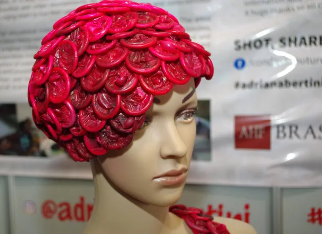 A mannequin wears headgear made of red condoms at the 2016 International AIDS Conference being held in Durban, South Africa, Tuesday, July 19, 2016. The gains the world has made against AIDS are “inadequate and fragile”, U.N. Secretary-General Ban Ki-moon told reporters Monday. More than half the people around the world infected with HIV, or 20 million people, still don't have access to treatment, he said. (Photo by AP Photo)