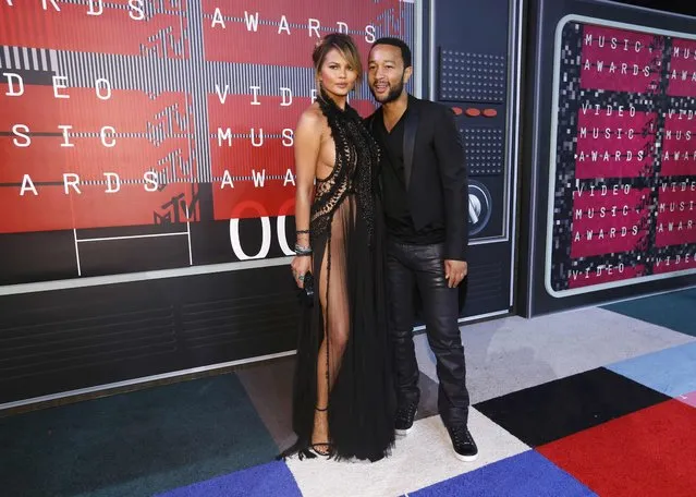 Model Chrissy Teigen and her husband, musician John Legend, arrive at the 2015 MTV Video Music Awards in Los Angeles, California August 30, 2015. (Photo by Mario Anzuoni/Reuters)