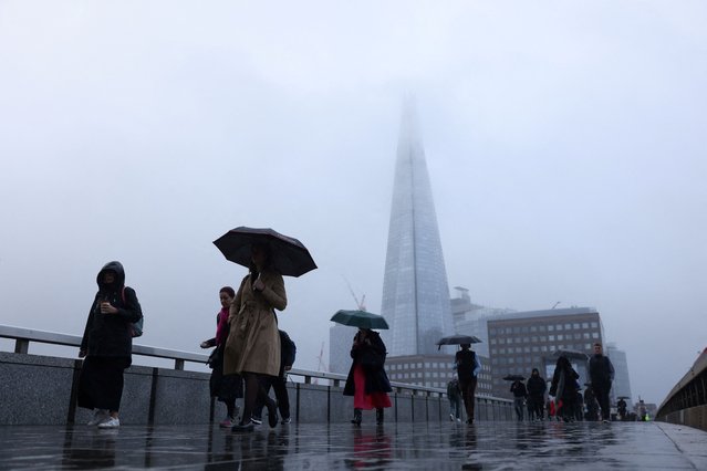 Commuters cross London Bridge, in London, Britain on October 29, 2024. (Photo by Hollie Adams/Reuters)