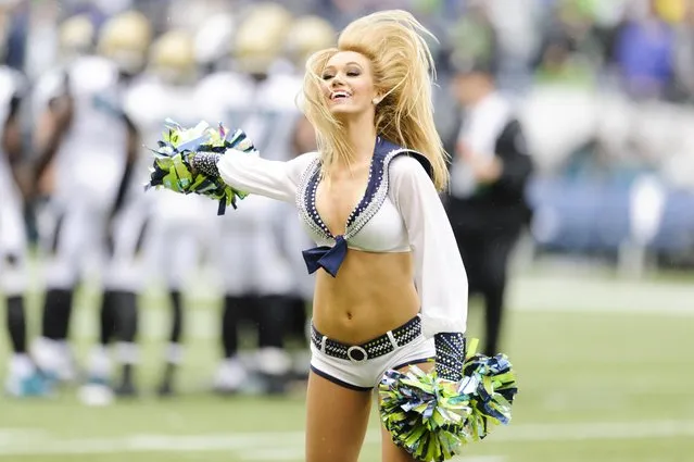 September 22, 2013; Seattle, WA, USA; Seattle Seahawks cheerleader performs during the game against the Jacksonville Jaguars at CenturyLink Field. (Photo by Steven Bisig/USA TODAY Sports)