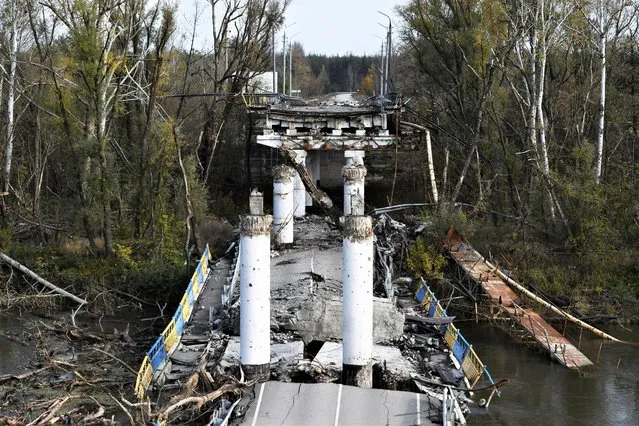 A view of a damaged bridge in the retaken village of Bohorodychne, eastern Ukraine, Saturday, October 22, 2022. (Photo by Andriy Andriyenko/AP Photo)