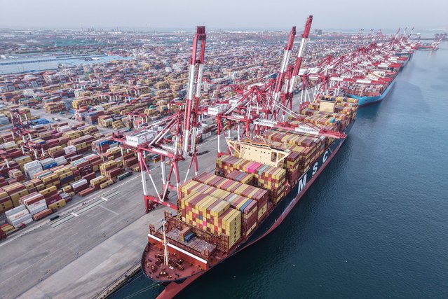 Container ships are berthed at a port in Qingdao, in China's eastern Shandong province on March 12, 2024. (Photo by AFP Photo/China Stringer Network)