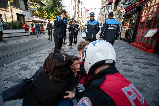 A boy affected by the blast is cared for after an explosion on Istiklal street, a busy pedestrian thoroughfare on November 13, 2022 in Istanbul, Turkey. It is unclear what caused the explosion that left at least four people dead and dozens injured, according to the city’s governor. The previous terrorist attack in Istanbul was in 2017, a nightclub mass shooting incident killing 39 people and wounded 79 others. (Photo by Burak Kara/Getty Images)