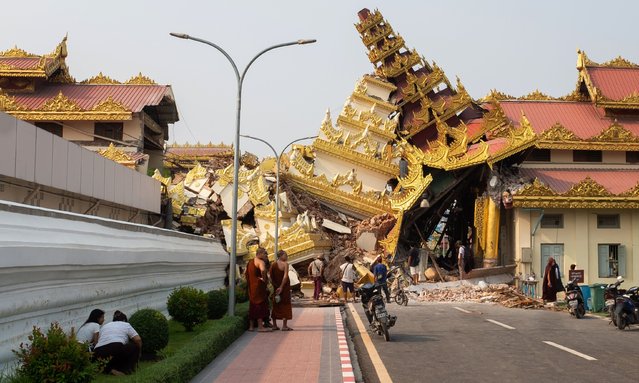 People look at the collapsed Maha Myat Muni Pagoda following an earthquake in Mandalay, Myanmar, 28 March 2025. Myanmar has declared a state of emergency and appealed for international aid after a 7.7-magnitude earthquake struck the country, killing more than 140 people, according to state media. (Photo by EPA/EFE/Stringer)