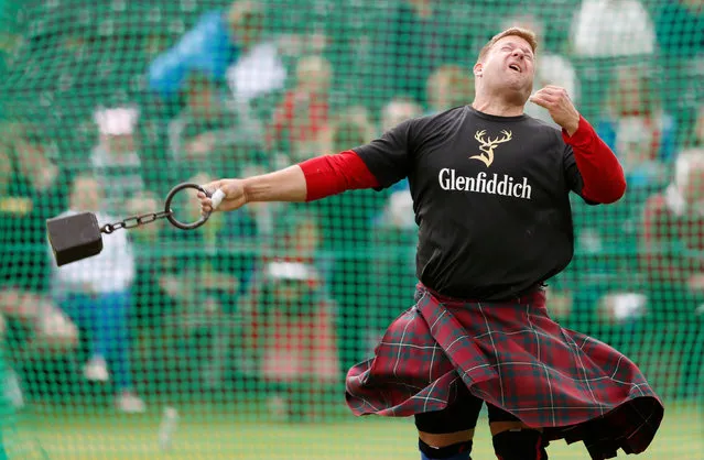 Scott Rider throws the heavy weight at annual Braemar Highland Gathering in Braemar, Scotland, Britain September 3, 2016. (Photo by Russell Cheyne/Reuters)