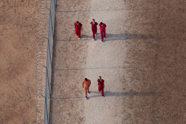 An aerial view shows Diover Jose Millan Leon of Venezuela, top left, and other detainees at the Bluebonnet Detention Facility in Anson, Texas, on April 23, 2025. Lawyers for Venezuelan migrants are trying to persuade judges across the country to require the government to give migrants 30 days' notice before deporting them under the 1798 Alien Enemies Act. (Photo by Daniel Cole/Reuters)