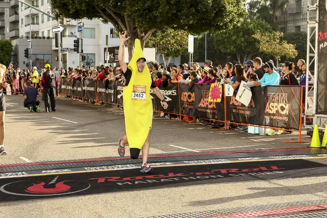 General view of a runner preparing to cross the finish line at the Rock 'n' Roll Los Angeles Halloween Half-Marathon and 5K benefitting the ASPCA on October 26, 2014 in Los Angeles, California. (Photo by Rich Polk/Getty Images for CGI)