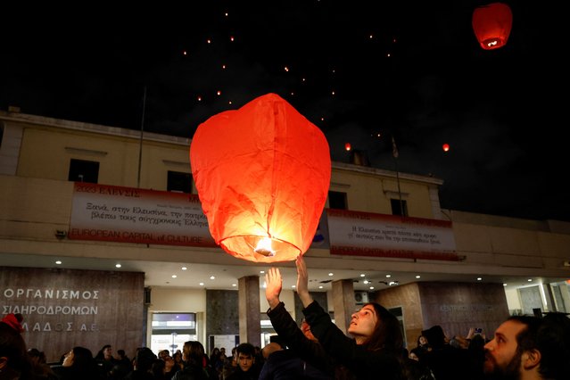People release 57 hot-air lanterns in front of the main train station in Athens, to mark the one-year anniversary of a deadly train crash, which killed 57 people, in Athens, Greece, on February 28, 2024. (Photo by Louisa Gouliamaki/Reuters)