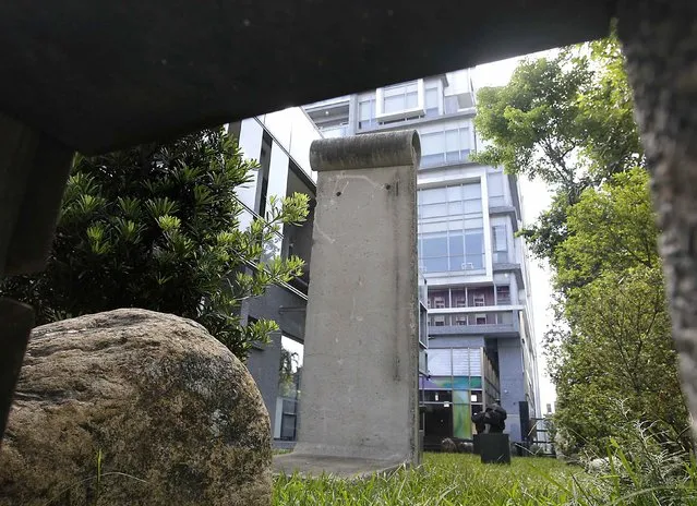 A piece of the Berlin Wall is seen in the front yard of the Taiwan Foundation for Democracy in Taipei October 20, 2014. (Photo by Pichi Chuang/Reuters)