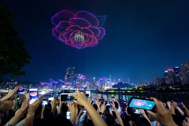 A drone light show featuring 11,787 drones set a new Guinness World Record on June 17, 2025 in Chongqing, China. The display earned the title for the largest aerial image formed by the most drones. (Photo by Li Hongbo/VCG via Getty Images)