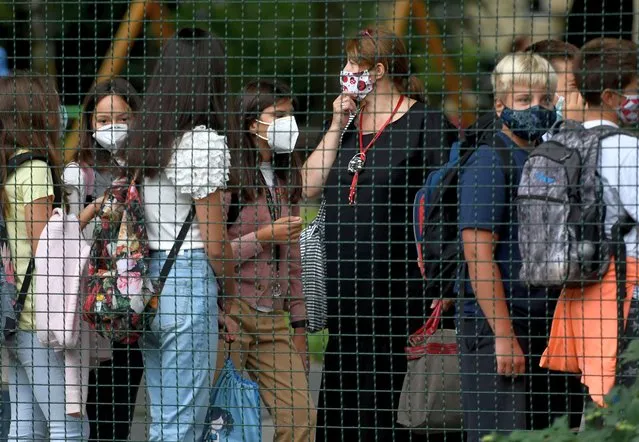 Children wearing protective face masks arrive at school on September 7, 2020 in Zagreb. School started in Croatia today with the implementation of epidemiological measures to combat the coronavirus pandemic. (Photo by Denis Lovrovic/AFP Photo)