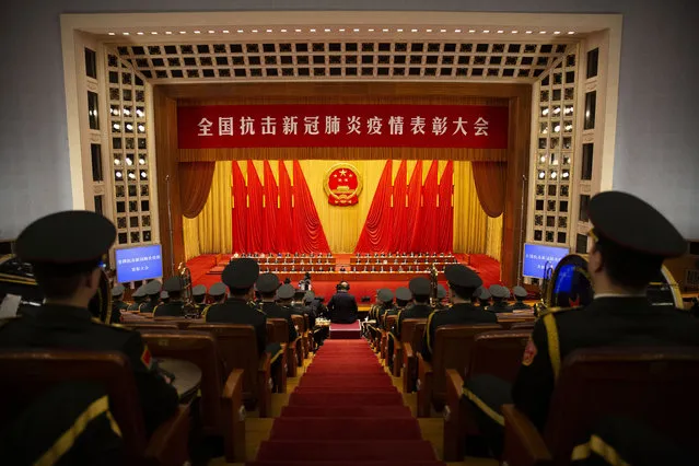 Members of Chinese military band watch an event to honor some of those involved in China's fight against COVID-19 at the Great Hall of the People in Beijing, Tuesday, September 8, 2020. (Photo by Mark Schiefelbein/AP Photo)