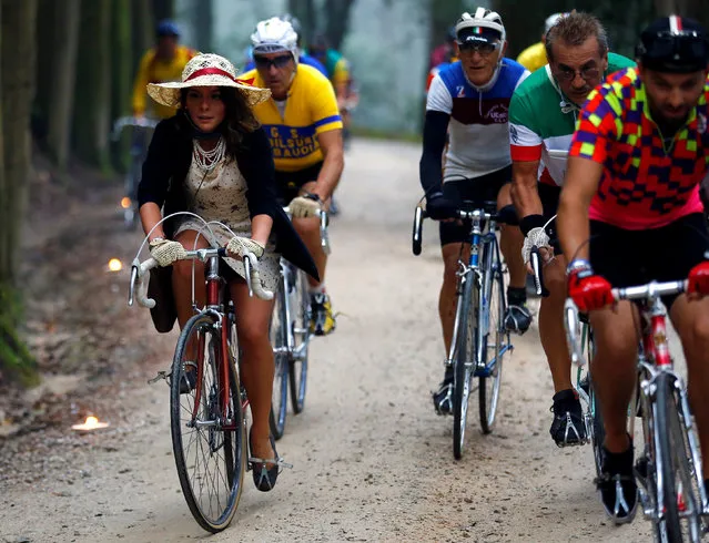 Cyclists ride vintage bicycles on gravel roads during the Strade Bianche section of the “Eroica” cycling race of old bikes in Gaiole in Chianti, Italy October 2, 2016. (Photo by Stefano Rellandini/Reuters)