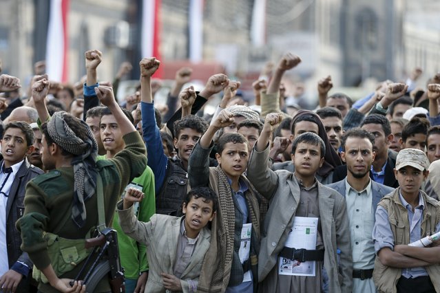 Houthi loyalists shout slogans as they attend a rally commemorating the 52nd anniversary of the start of South Yemen's uprising against British rule, in Sanaa October 14, 2015. (Photo by Khaled Abdullah/Reuters)
