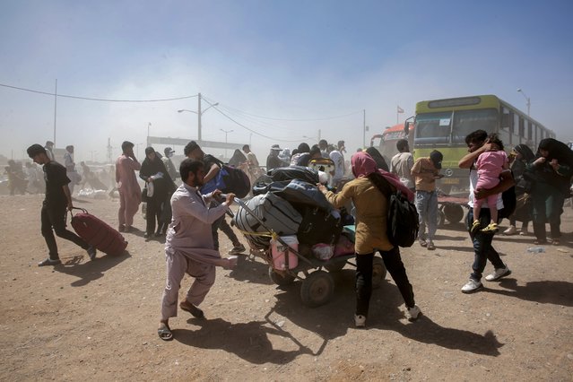 Afghan refugees, who have returned from neighboring Iran, gather at a temporary camp at Islam Qala border, Herat province, Afghanistan, 11 July 2025. Afghanistan is grappling with a humanitarian crisis as Iran intensifies the deportation of Afghan refugees. The Taliban government admits to a lack of resources to support these returnees, amid a backdrop of economic turmoil and reduced international aid. (Photo by Samiullah Popal/EPA)
