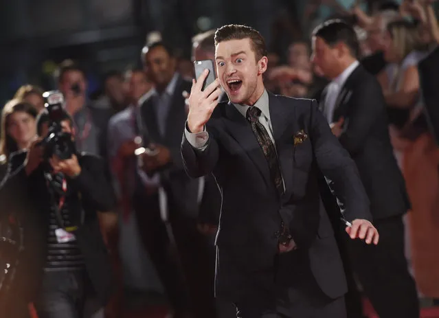 Justin Timberlake, star of the concert film “Justin Timberlake + The Tennessee Kids”, films fans on his cell phone as he arrives at the premiere of the film on day 6 of the Toronto International Film Festival at Roy Thomson Hall on Tuesday, September 13, 2016, in Toronto. (Photo by Chris Pizzello/Invision/AP Photo)