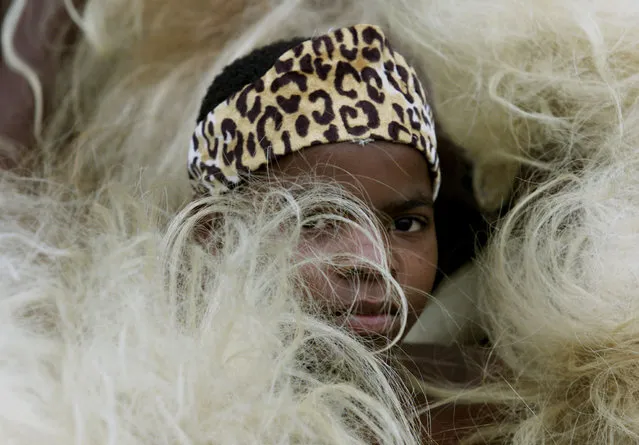 A boy dressed as a traditional Zulu warrior attends the launching ceremony of the African Union (AU) at the ABSA stadium in Durban July 9, 2002. (Photo by Juda Ngwenya/Reuters)