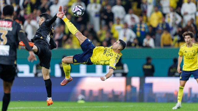 Cristiano Ronaldo of team Al-Nassr FC scores their fourth goal during the Saudi Pro League match between Al Nassr and Al Khaleej at Al Awwal Park on November 23, 2025 in Riyadh, Saudi Arabia. (Photo by Abdullah Ahmed/Getty Images)