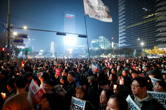 Tens of thousands of South Korean people march during a rally calling on embattled President Park Geun-hye to resign over a growing influence-peddling scandal, in central Seoul, South Korea, November 5, 2016. (Photo by Kim Hong-Ji/Reuters)
