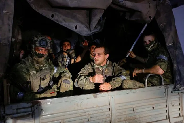 Fighters of Wagner private mercenary group pull out of the headquarters of the Southern Military District to return to base, in the city of Rostov-on-Don, Russia on June 24, 2023. (Photo by Reuters/Stringer)