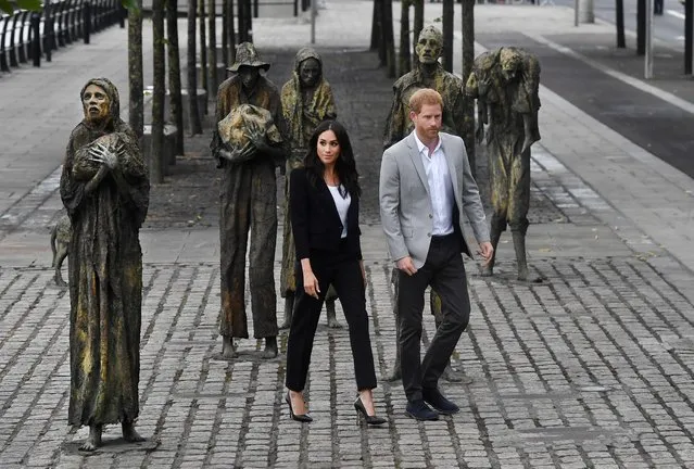 Prince Harry, Duke of Sussex and Meghan, Duchess of Sussex visit the Famine Memorial at Custom House Quay on the second day of their official two day royal visit to Ireland on July 11, 2018 in Dublin, Ireland. The statues commemorate the Great Famine of the mid 19th century, during which a million people died and a million more emigrated. It is the royal couple's first foreign trip together since they were married earlier this year. (Photo by Charles McQuillan/Getty Images)