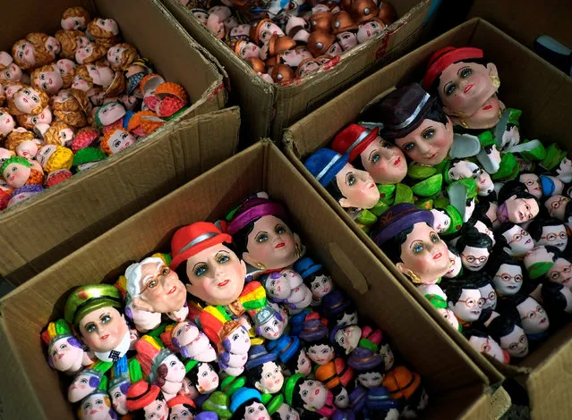 Masks of “T'antawawas” (children's bread) are displayed in a popular market to commemorate All Saints Day in La Paz, October 30, 2016. (Photo by David Mercado/Reuters)
