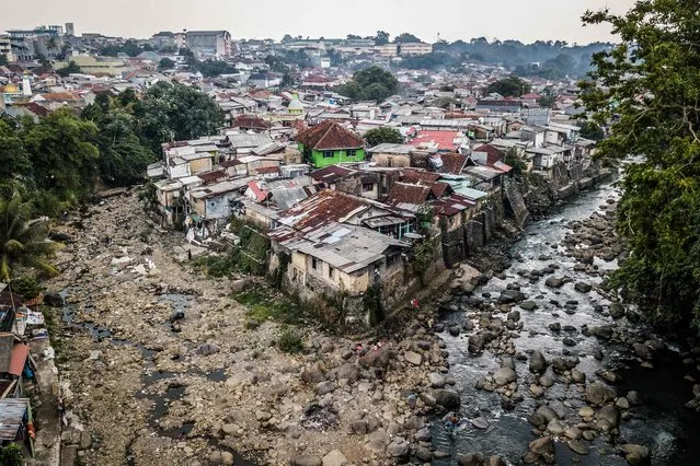 The aerial photo shows the exposed Ciliwung riverbed with low water levels in Bogor, West Java on August 3, 2023. (Photo by Aditya AJI/AFP Photo)