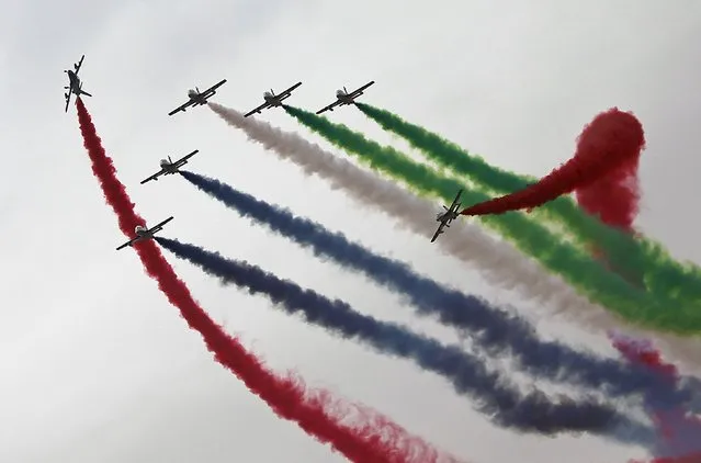 Aircraft perform during a show at the opening ceremony of the International Defence Exhibition and Conference (IDEX) in Abu Dhabi February 22, 2015. The event, which aims to showcase the latest technology in defence, runs from from February 22 to 26. (Photo by Reuters/Stringer)