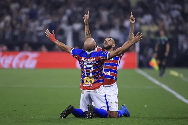 Fortaleza's midfielder Ze Welison (L) celebrates with Fortaleza's forward Guilherme after scoring during the all-Brazilian Copa Sudamericana semifinals first leg football match between Corinthians and Fortaleza, at the Neo quimica Arena stadium, in Sao Paulo, Brazil, on September 26, 2023. (Photo by Marcello Zambrana/AFP Photo)