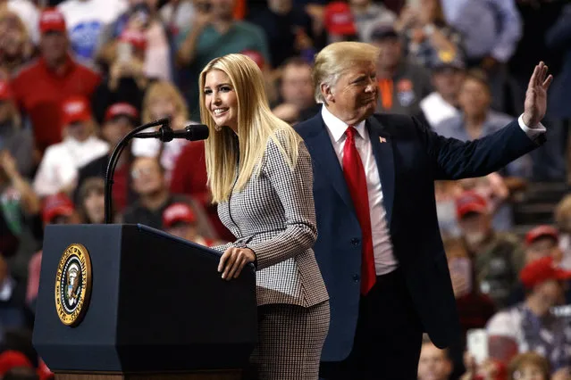 President Donald Trump stands on stage with his daughter Ivanka Trump as she speaks during a campaign rally at the IX Center, in Cleveland, Monday, November 5, 2018, (Photo by Carolyn Kaster/AP Photo)