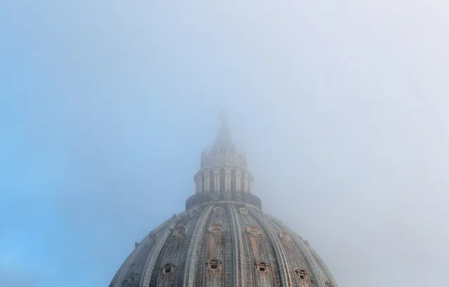 The dome of Saint Peter's Basilica is seen covered in fog, before Pope Francis' weekly general audience in Saint Peter's Square at the Vatican on November 14, 2018. (Photo by Max Rossi/Reuters)