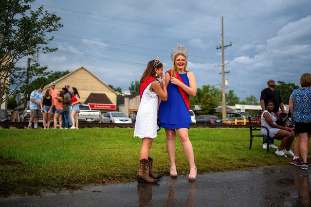 Carlee Leblac, who is Erath's Miss Teen 4th of July 2021 and Haylie Rudisill, 17, who is Erath's Miss 4th of July 2021 joke around as 4th of July weekend celebrations take place in Erath, Louisiana, U.S., July 3, 2021. (Photo by Kathleen Flynn/Reuters)