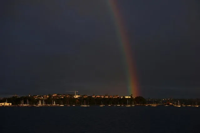 A rainbow is seen over Auckland, New Zealand on August 12, 2023. (Photo by Molly Darlington/Reuters)