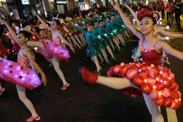 Performers from “Jean M. Wong school of Ballet” of Hong Kong take part in a Lunar New Year night parade in Hong Kong, February 5, 2019. (Photo by Tyrone Siu/Reuters)