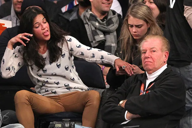 1/7/2014 - Detroit Pistons vs. New York Knicks at Madison Square Garden - Actress Michelle Rodriguez and model Cara Delevingne sitting in the front row during the 4th quarter. The two were hugging and touching each other and Rodriguez appeared to be very intoxicated.