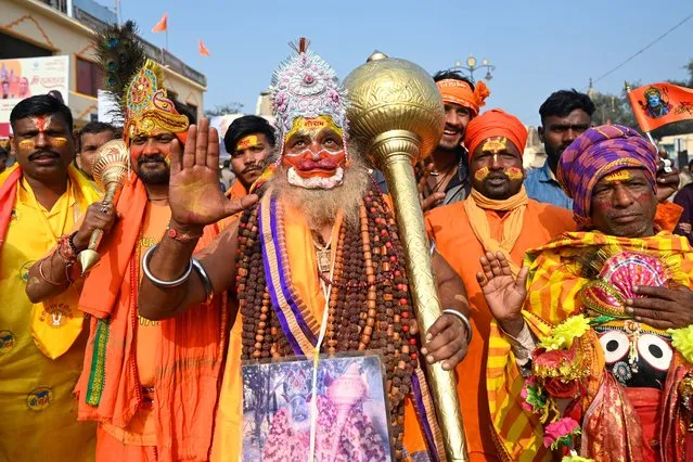 A devotee dresses as Hindu deity lord Hanuman, in Ayodhya on January 22, 2024. India's Prime Minister Narendra Modi inaugurated the temple on January 22 that embodies the triumph of his muscular Hindu nationalist politics, galvanising loyalists in an unofficial start to his re-election campaign this year. (Photo by Money Sharma/AFP Photo)